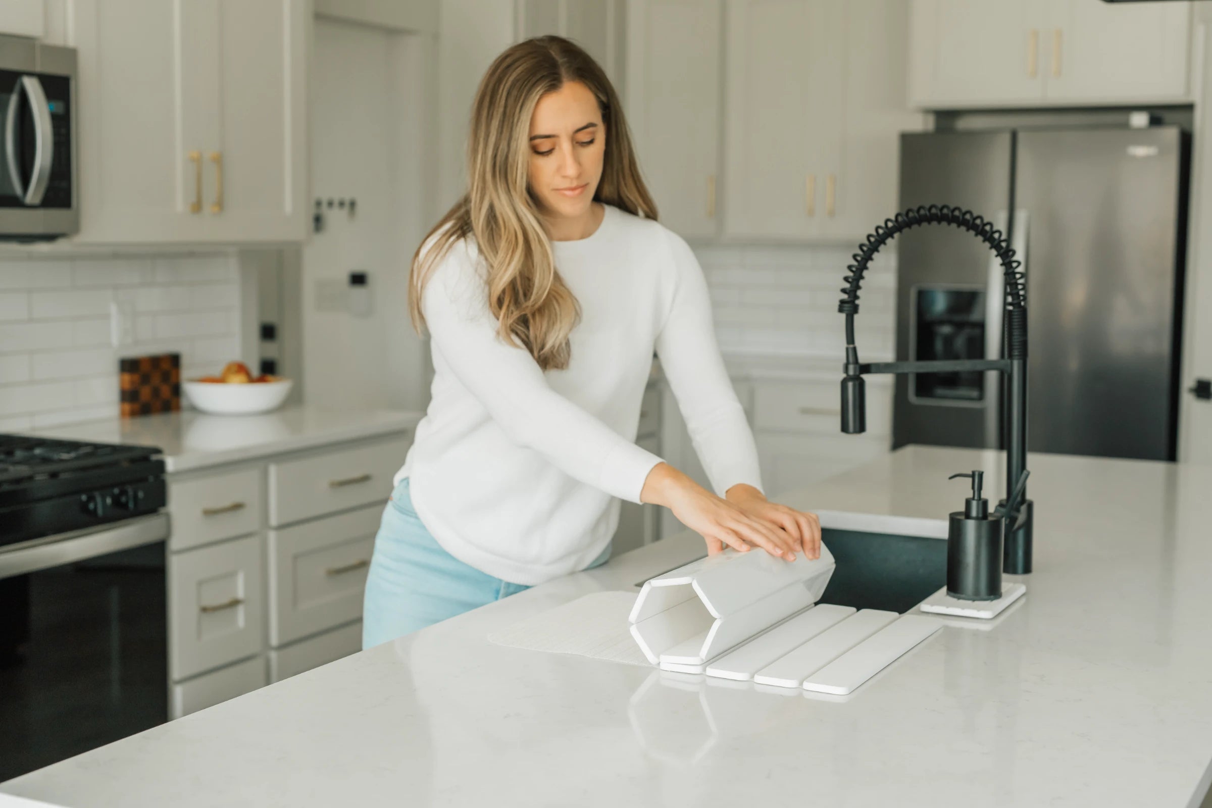 Stone dish drying mat on a modern kitchen counter with dishes drying