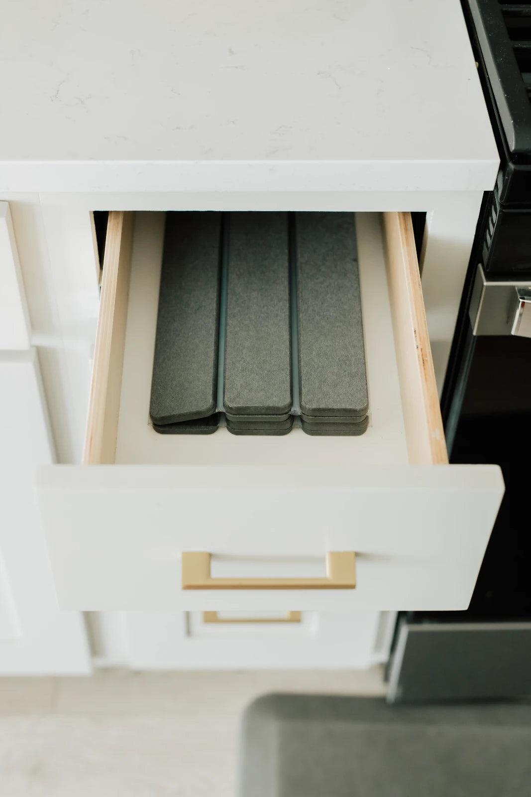 Foldable stone drying mat stored neatly inside kitchen drawer
